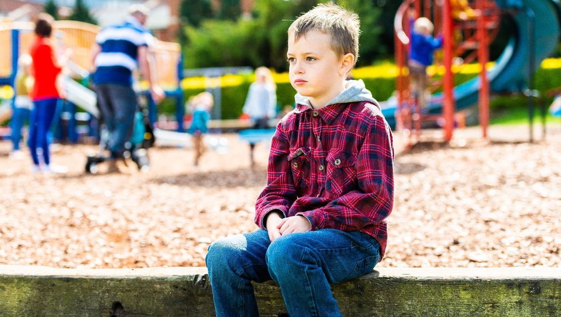 autistic boy at a playground